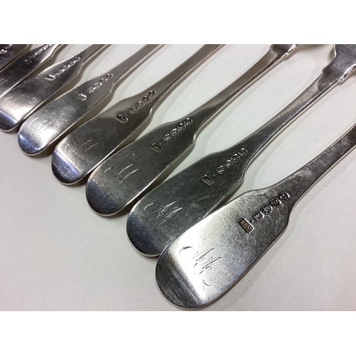 402 - A matched set of nine heavy silver fiddle pattern table forks. London. By WE. Approx. 630 grams. Est... 