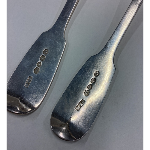 404 - A heavy pair of silver fiddle pattern tablespoons. London. By WRS. Approx. 149 grams. Est. £60 - £80... 