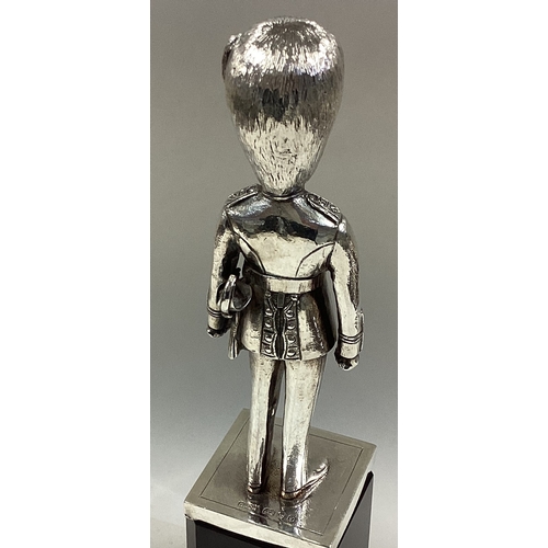 41 - A cast silver figure of a Grenadier Guard. London  1978. By Carrington & Co. Approx. 343 grams of gr... 