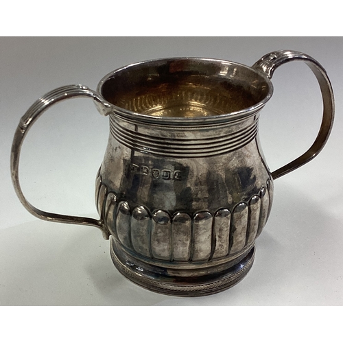 434 - A Georgian silver two-handled cup. 1815. By Henry Nutting. Approx. 118 grams. Est. £120 - £150.