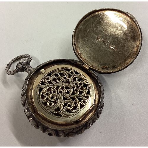 44 - A good quality circular Georgian silver vinaigrette with chased decoration. London. By JR. Approx. 1... 