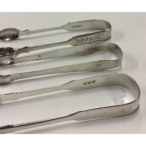 440 - A good pair of bright-cut silver sugar tongs together with two other examples. Approx. 114 grams. Es... 