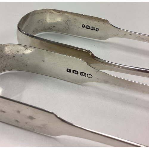 441 - EXETER: Two good pairs of silver fiddle pattern sugar tongs. Approx. 77 grams. Est. £25 - £30.