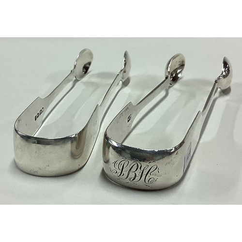 441 - EXETER: Two good pairs of silver fiddle pattern sugar tongs. Approx. 77 grams. Est. £25 - £30.