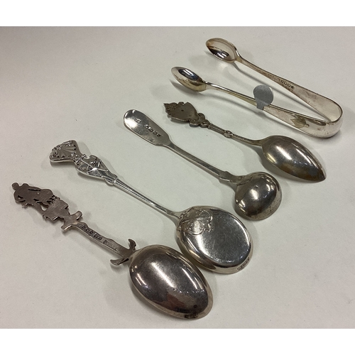 444 - Three silver souvenir spoons together with a salt spoon, tongs etc. Various dates and makers. Approx... 