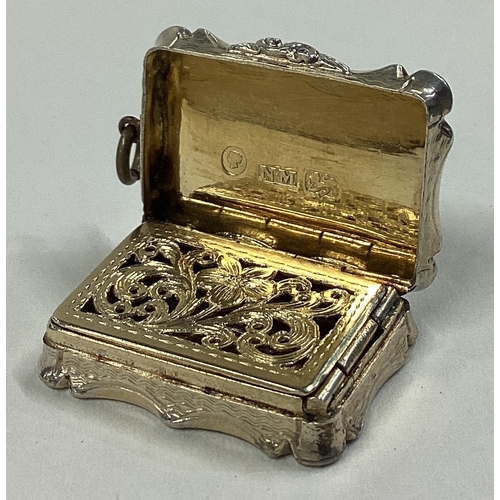 45 - A small hinged top silver vinaigrette with gilt interior. Birmingham. By Nathaniel Mills. Approx. 11... 