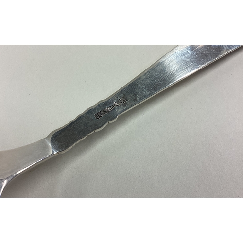 47 - A stylish silver spoon with scroll decoration. Approx. 74 grams. Est. £30 - £50.