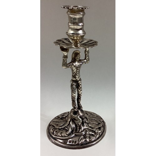 471 - CHESTER: A silver taperstick with figural Harlequin stem. 1917. By George Nathan & Ridley Hayes. App... 