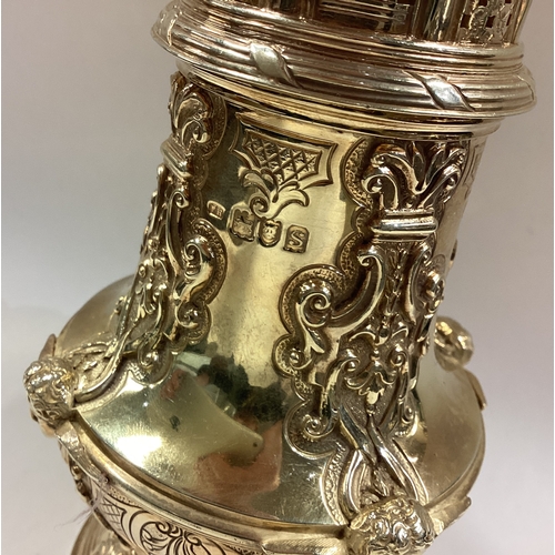 477 - A silver gilt sugar caster embossed with angels. London 1913. By Frederick William Hentsch. Approx. ... 