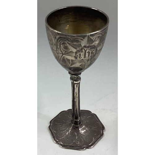 495 - A Victorian silver communion goblet with engraved decoration. London 1850. By George Reilly. Approx.... 