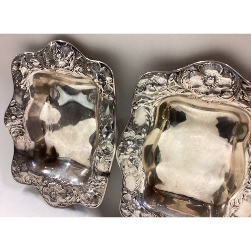 501 - A pair of American silver dishes with chased decoration. Marked Sterling. Approx. 232 grams. Est. £2... 