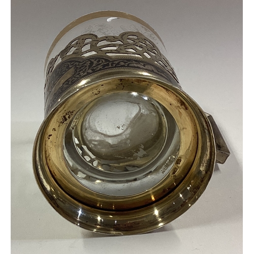 53 - A Russian silver and Niello tea glass holder with glass liner. Marked to base. Approx. 87 grams. Est... 