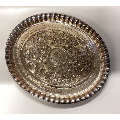 536 - A heavy Eastern silver tray with large central elephant decoration. Approx. 220 grams. Est. £100 - £... 