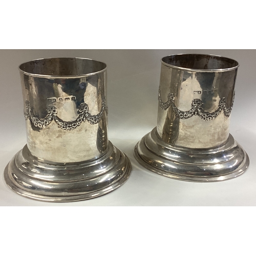 551 - A pair of silver ice buckets with swag decoration. Birmingham 1908. By WGK. Approx. 277 grams. Est. ... 