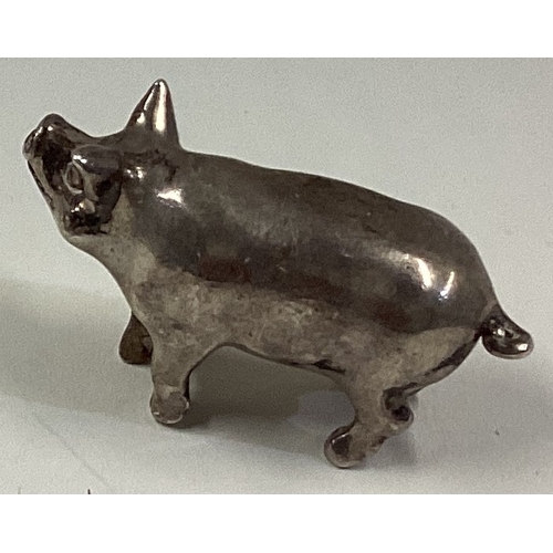 613 - A silver figure of a pig. Approx. 75 grams. Est. £100 - £150.