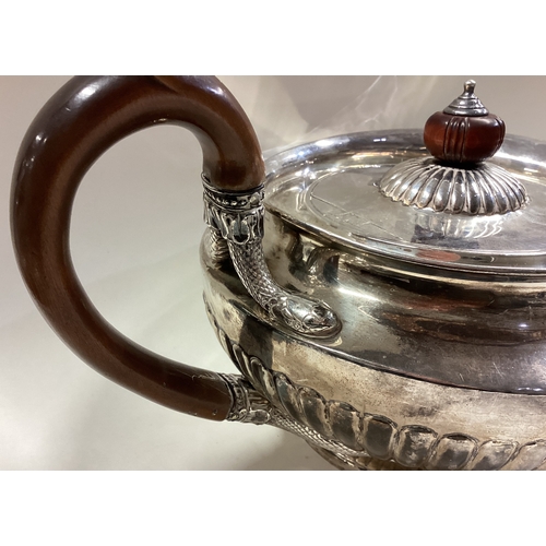 621 - A fine George III silver fluted teapot with snake decoration. London 1782. By Richard Sibley. Approx... 