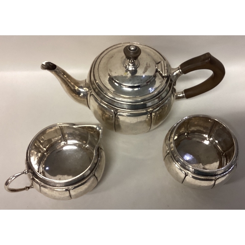 632 - LIBERTY & CO: A fine and rare silver three-piece bachelor's tea service of typical form. Birmingham.... 