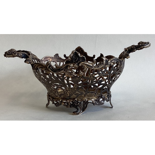 653 - An attractive silver gilt pierced basket with floral decoration. London. By William Comyns. Approx. ... 