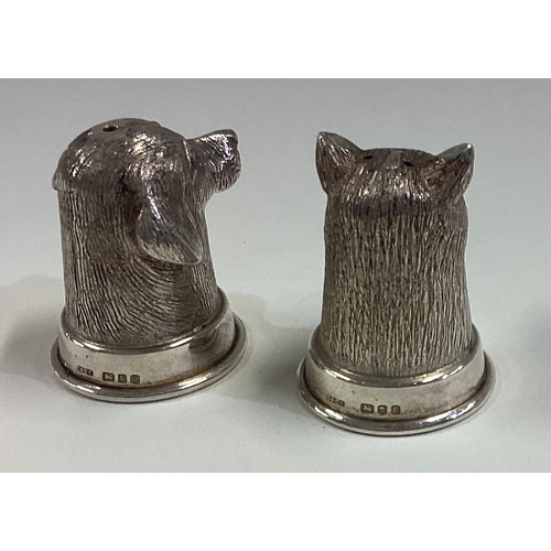 659 - A pair of novelty Elizabeth II cast silver peppers in the form of heads of a fox and a hound. London... 