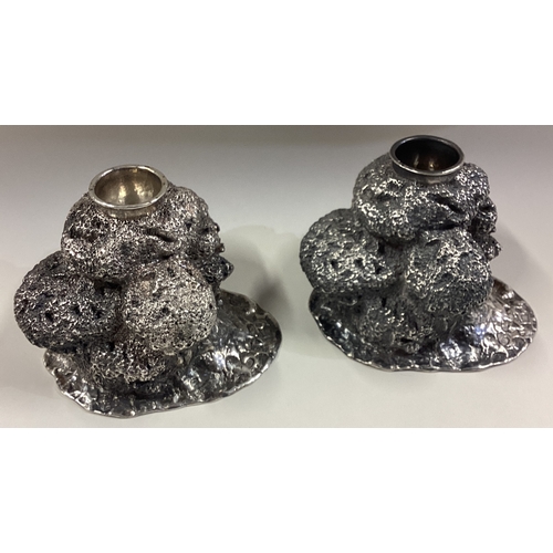 667 - PATRICK MAVROS: A very fine and heavy pair of Naturalistic silver candlesticks. Zimbabwe 2004. Appro... 