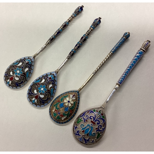 676 - A group of four Russian silver and enamelled spoons. Approx. 70 grams. Est. £50 - £80.