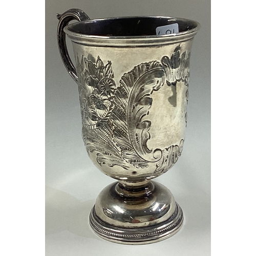 691 - A Victorian silver christening mug with chased decoration. Birmingham 1844. By George Unite. Approx.... 