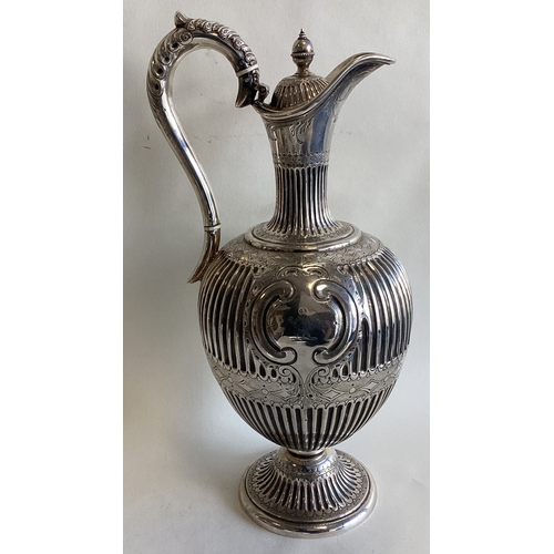 696 - A large Victorian silver claret jug. Sheffield 1861. By MH & Co. Approx. 676 grams. Est. £600 - £800... 