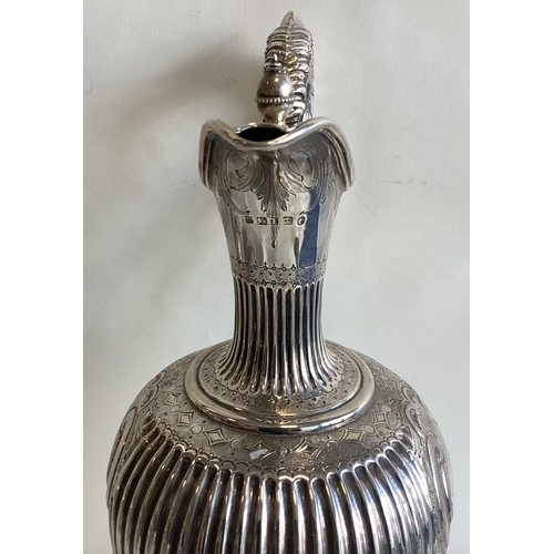 696 - A large Victorian silver claret jug. Sheffield 1861. By MH & Co. Approx. 676 grams. Est. £600 - £800... 