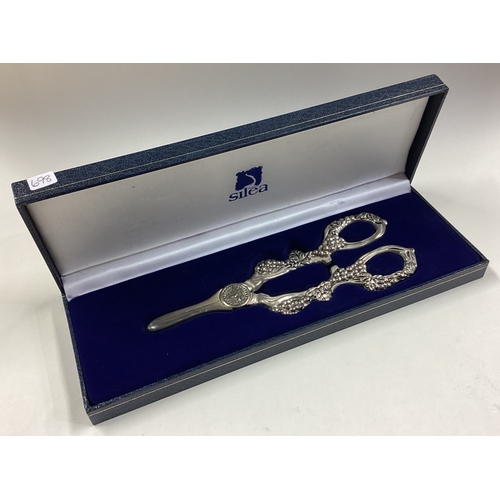 698 - A cased pair of silver grape scissors. Approx. 116 grams. Est. £80 - £120.