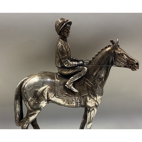 70 - A large silver figure of a racehorse and rider. London 1987. Approx. 1140 grams of gross weight. Est... 