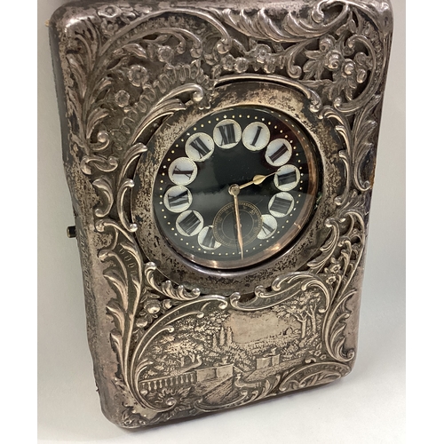 700 - A large silver clock with castle scene. Birmingham 1899. By Henry Matthews. Approx. 373 grams of gro... 