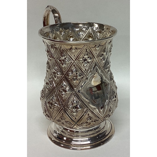 703 - A stylish Victorian silver miniature christening cup with floral decoration. Approx. 85 grams. Est. ... 