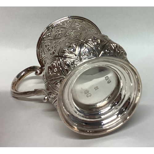 703 - A stylish Victorian silver miniature christening cup with floral decoration. Approx. 85 grams. Est. ... 