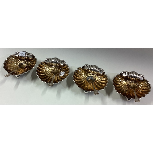 725 - An attractive set of four silver and silver gilt salts on ball feet. Birmingham. By HM. Est. £50 - £... 