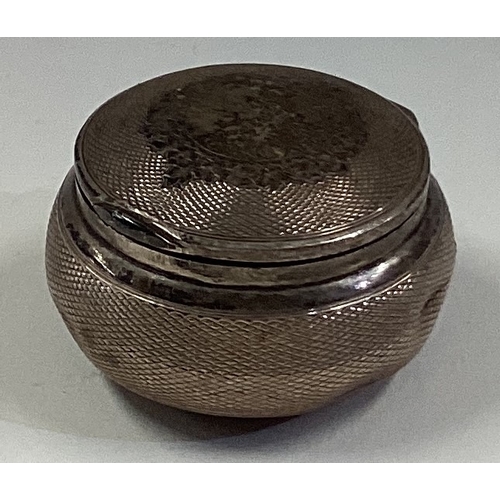 732 - An engine turned French silver hinged tobacco / snuff box. Approx. 24 grams. Est. £30 - £40.