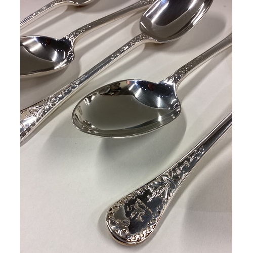 739 - A good set of six cast silver dessert spoons with crested terminals. London. By George Adams. Approx... 