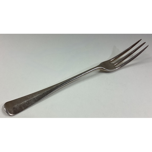 743 - An 18th Century three-pronged silver fork. Approx. 34 grams. Est. £50 - £80.