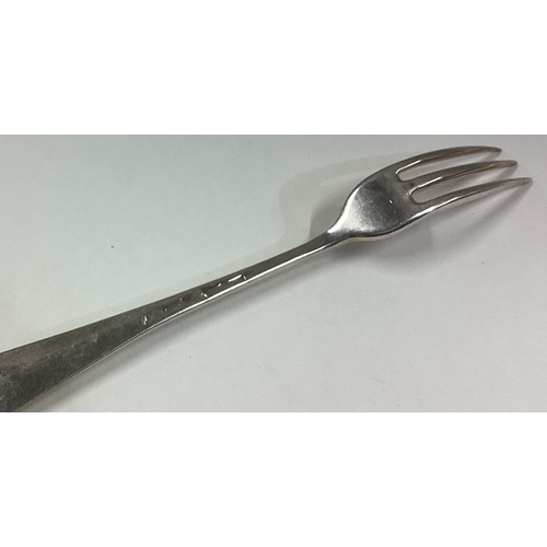 744 - An 18th Century three-pronged silver fork. Approx. 36 grams. Est. £50 - £80.