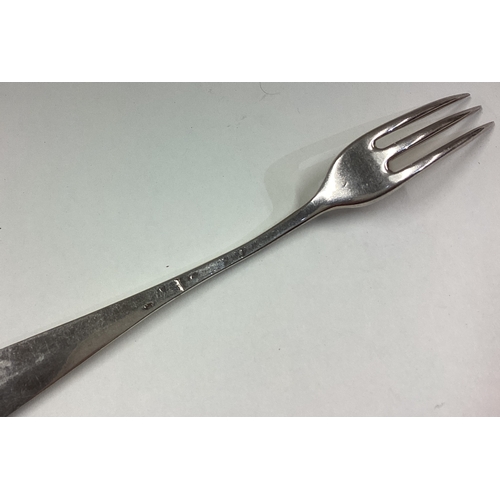 745 - An 18th Century three-pronged silver fork. Approx. 33 grams. Est. £50 - £80.