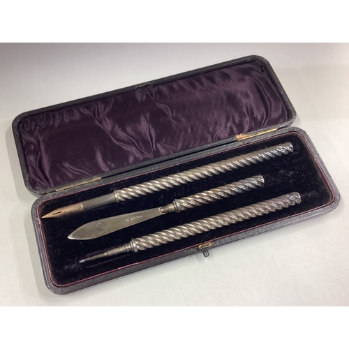 753 - A rare cased writing set comprising of silver quill and letter opener. Birmingham 1891. By William N... 