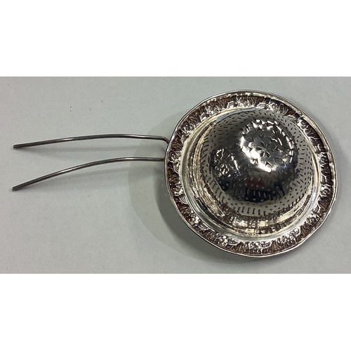 768 - A 19th Century French silver tea strainer. Approx. 10 grams. Est. £40 - £60.