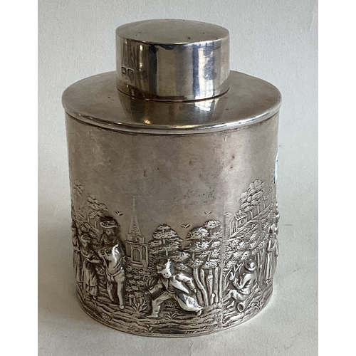 776 - CHESTER: A good cylindrical silver tea canister decorated with figures to lift-off cover. By BN. App... 