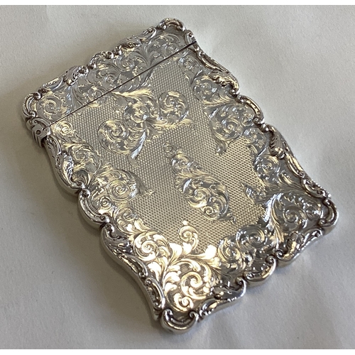 783 - An attractive engraved silver calling card case decorated with scrolls and flowers. Birmingham. By W... 