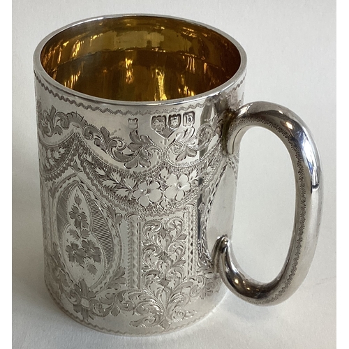 784 - A fine quality Edwardian silver christening cup engraved with swags and flowers. London. By GJ&DF. A... 