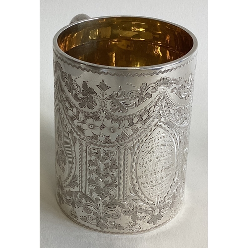 784 - A fine quality Edwardian silver christening cup engraved with swags and flowers. London. By GJ&DF. A... 