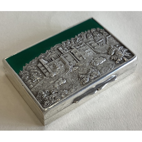 789 - A fine quality hinged silver castle top box with green enamelled decoration. London. By CC. Approx. ... 