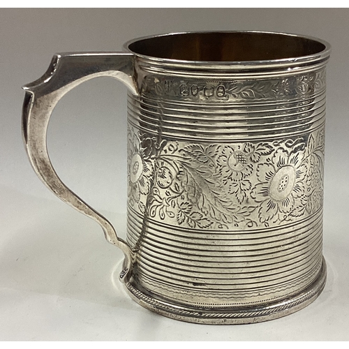 80 - A Georgian silver mug with bright-cut decoration. London 1803. Approx. 147 grams. Est. £150 - £200.