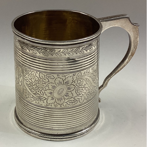 80 - A Georgian silver mug with bright-cut decoration. London 1803. Approx. 147 grams. Est. £150 - £200.