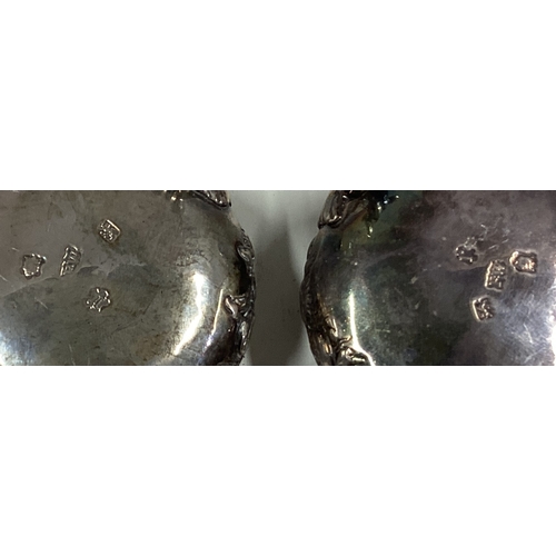 81 - A pair of 18th Century silver salt cellars with chased decoration. London 1752. By Fuller White. App... 