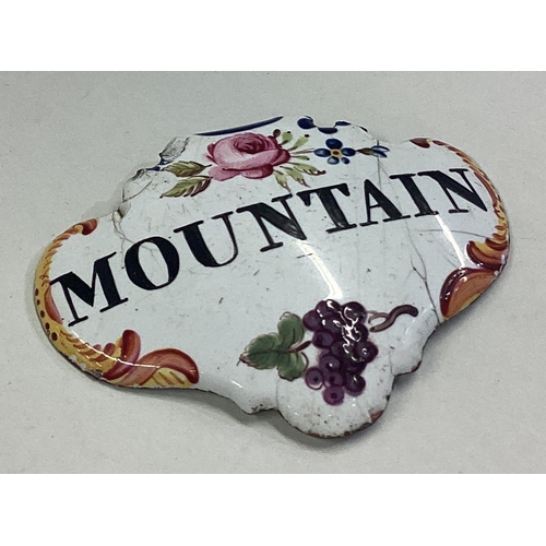 93 - An 18th Century porcelain wine label for 'Mountain'. Est. £20 - £30.